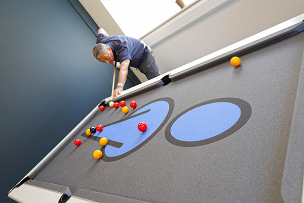employee playing pool