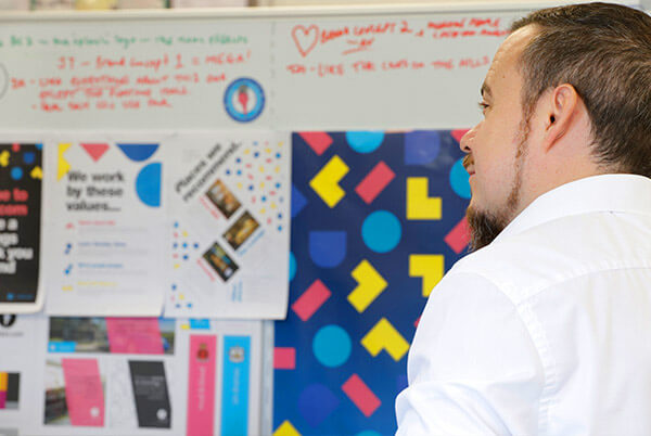 director looking at a white board